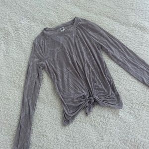 Joylab long sleeve work out top with slit opening in the front.